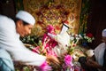 Islamic Wedding, groom putting a gold necklace on bride. Tradition of Thai Muslim. Bride wearing head scarf hijab veil, groom in